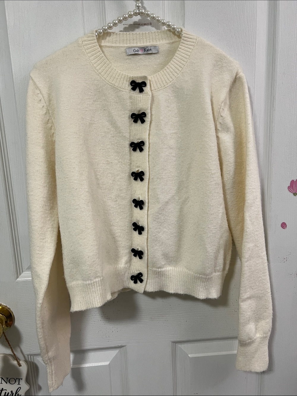 Cream Knit Cardigan with Black Bow Buttons